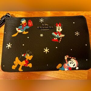 NWOT Disney Coach Wristlet with Christmas theme
